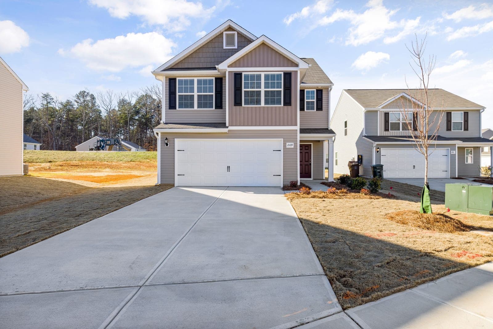 A finished concrete driveway at a family home.